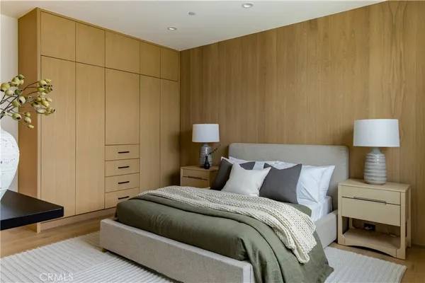 a bathroom with a granite countertop sink a mirror and a shower