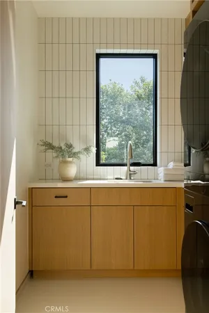 a front view of a house with a yard table and chairs