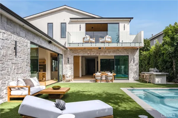 an aerial view of multiple houses with outdoor space