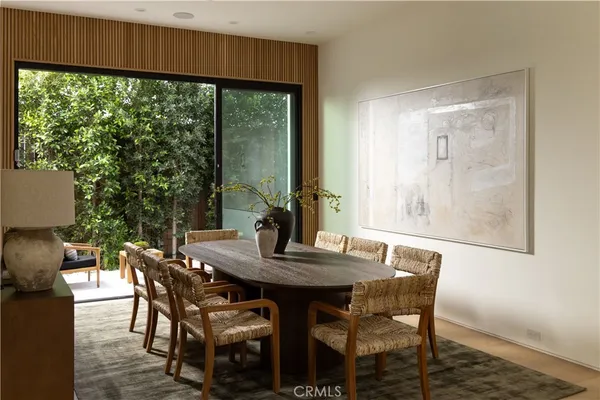 a view of a dining room with furniture and window