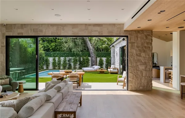 a view of swimming pool and outdoor seating