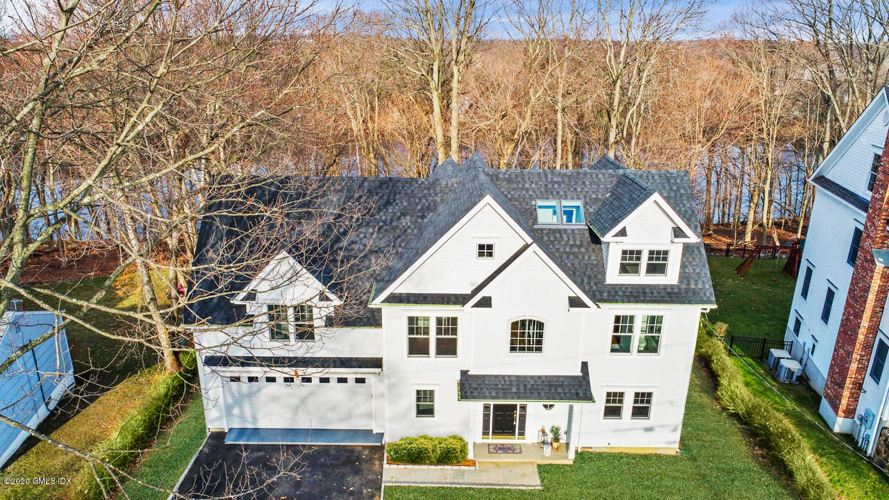 72 Riverside Lane Riverside, CT 06878 - Photo 1 of 40 a view of house with a big yard