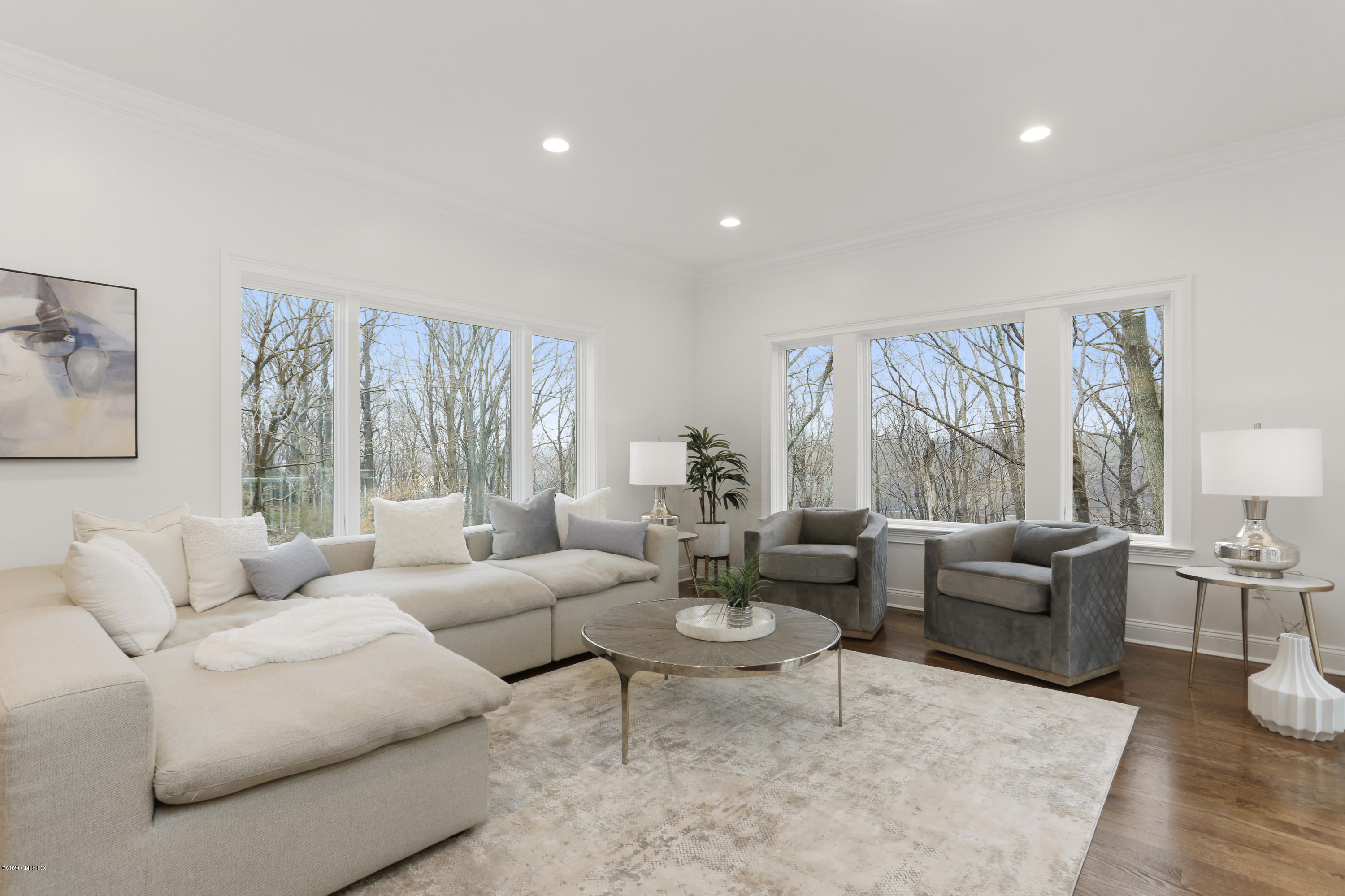 72 Riverside Lane Riverside, CT 06878 - Photo 12 of 40 a living room with furniture and a large window