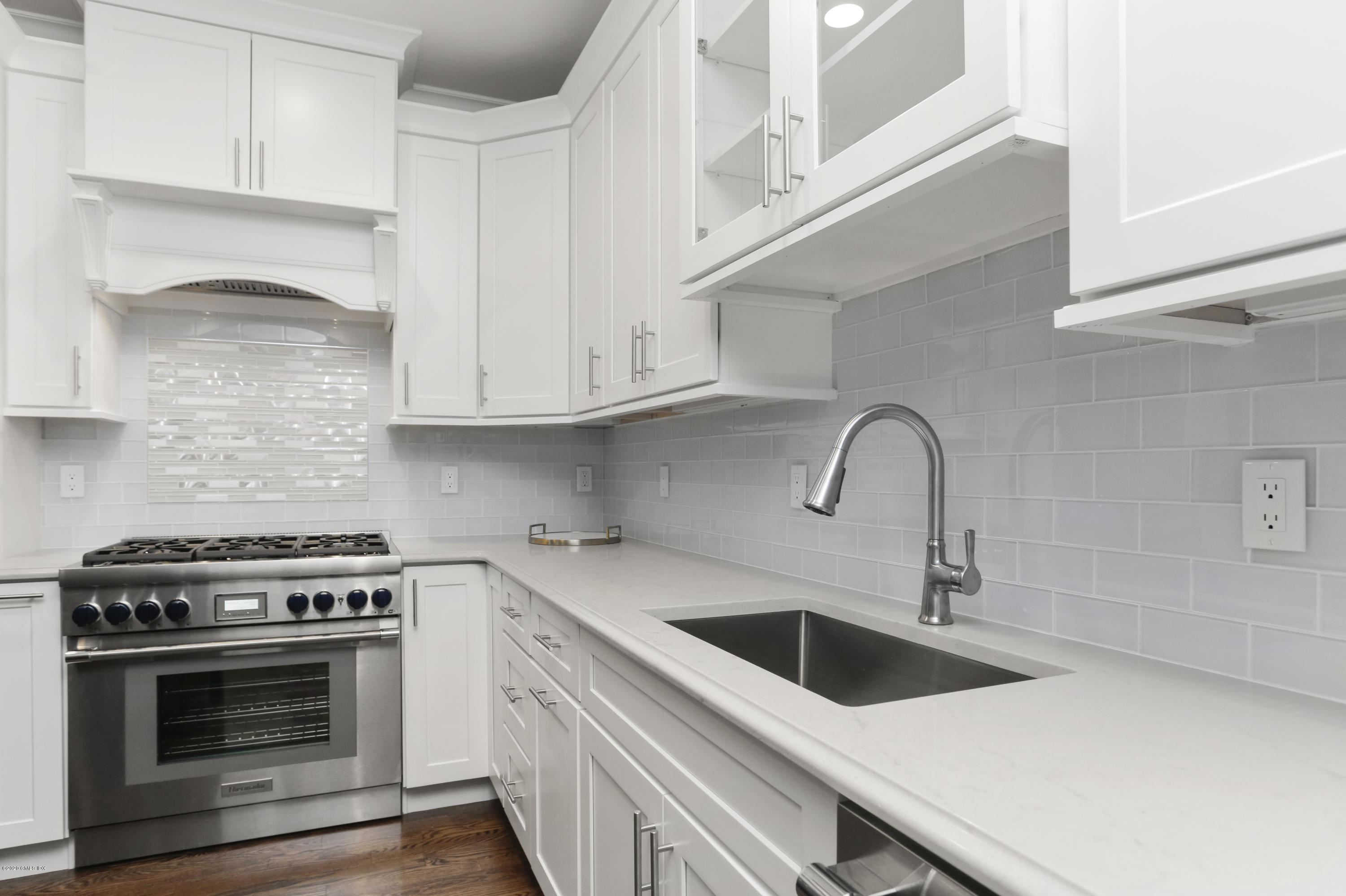72 Riverside Lane Riverside, CT 06878 - Photo 20 of 40 a kitchen with sink a stove and microwave