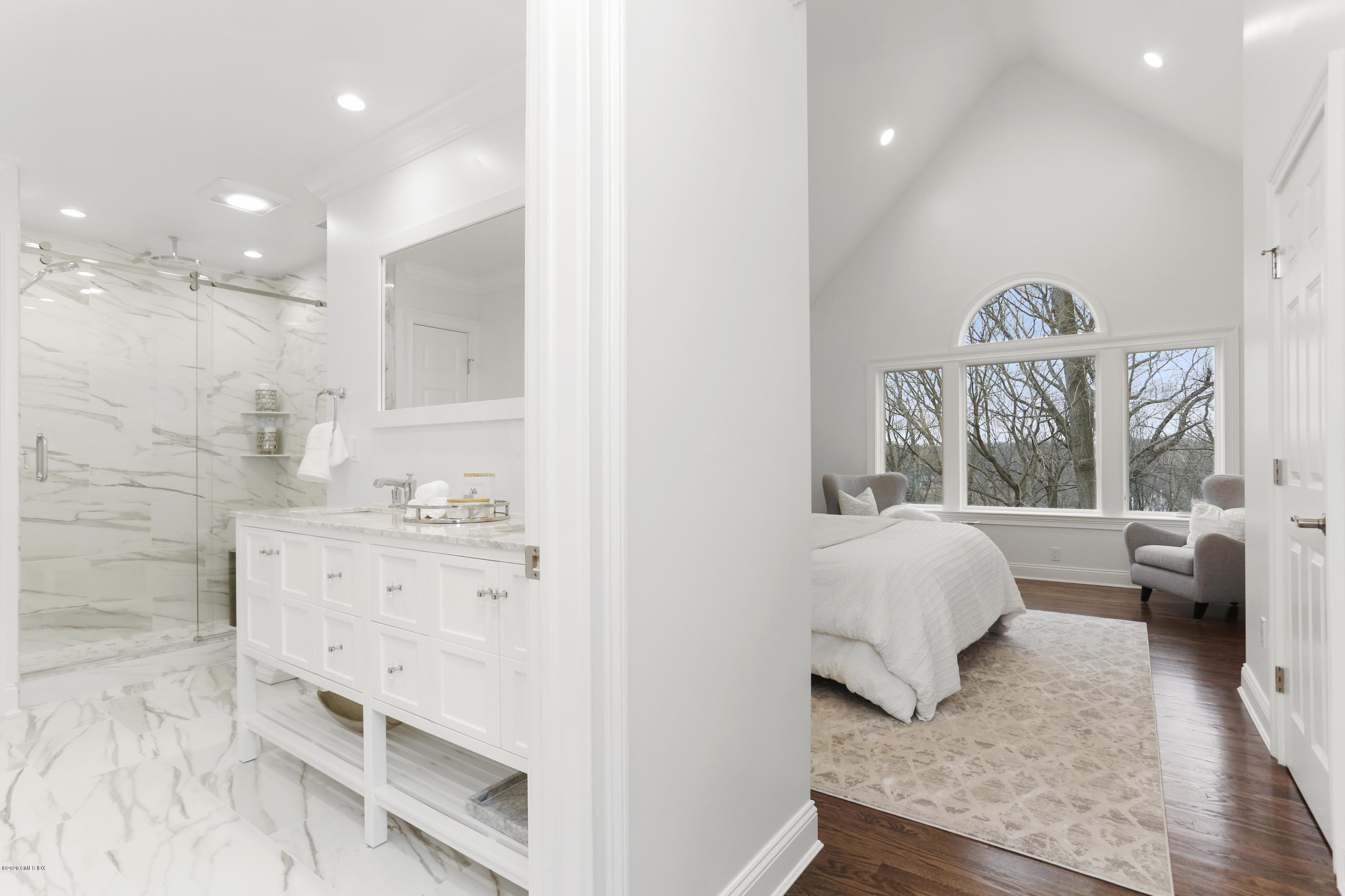 72 Riverside Lane Riverside, CT 06878 - Photo 26 of 40 a spacious bedroom with a bed and a couch