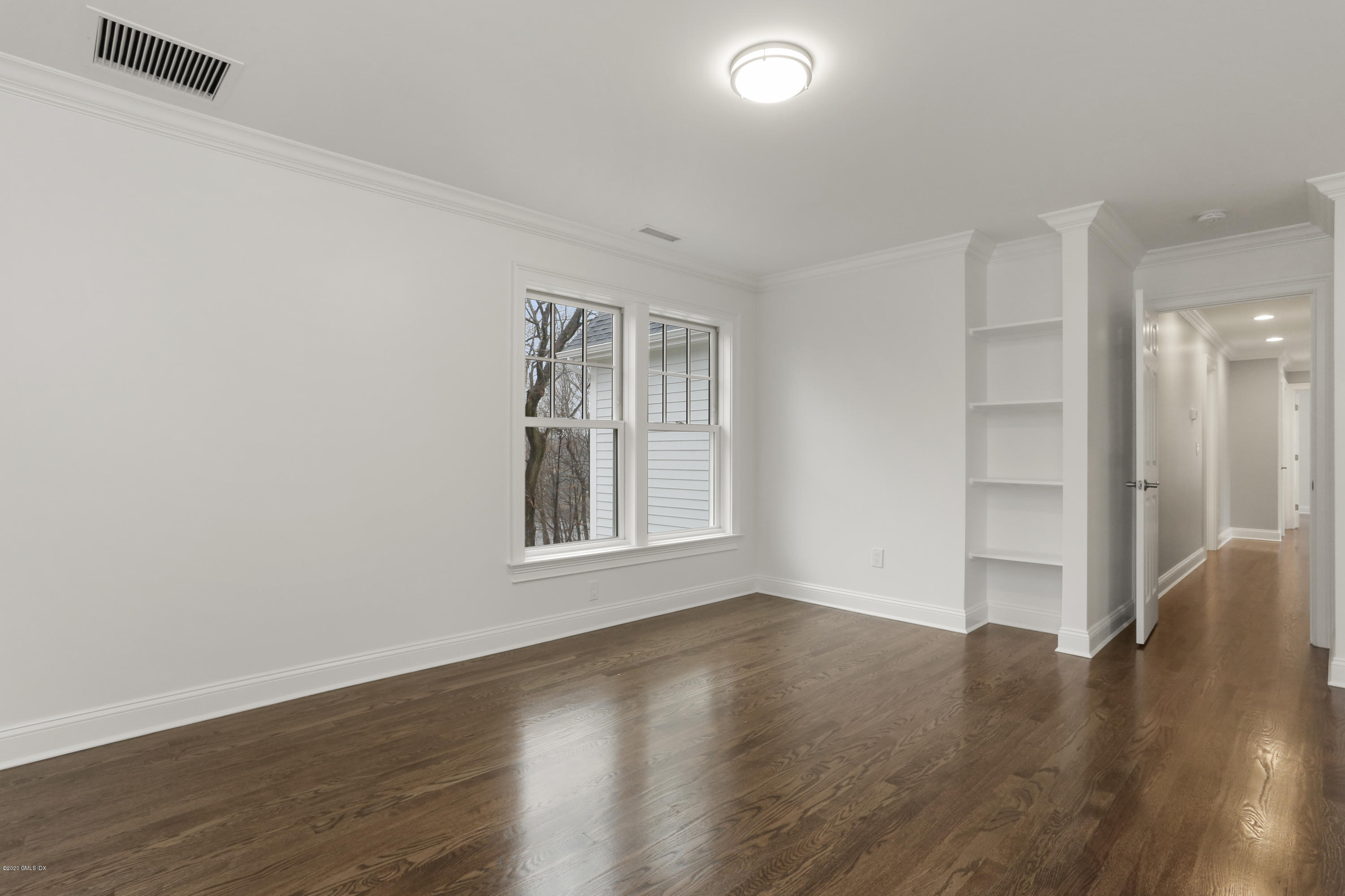 72 Riverside Lane Riverside, CT 06878 - Photo 27 of 40 wooden floor in an empty room with a window
