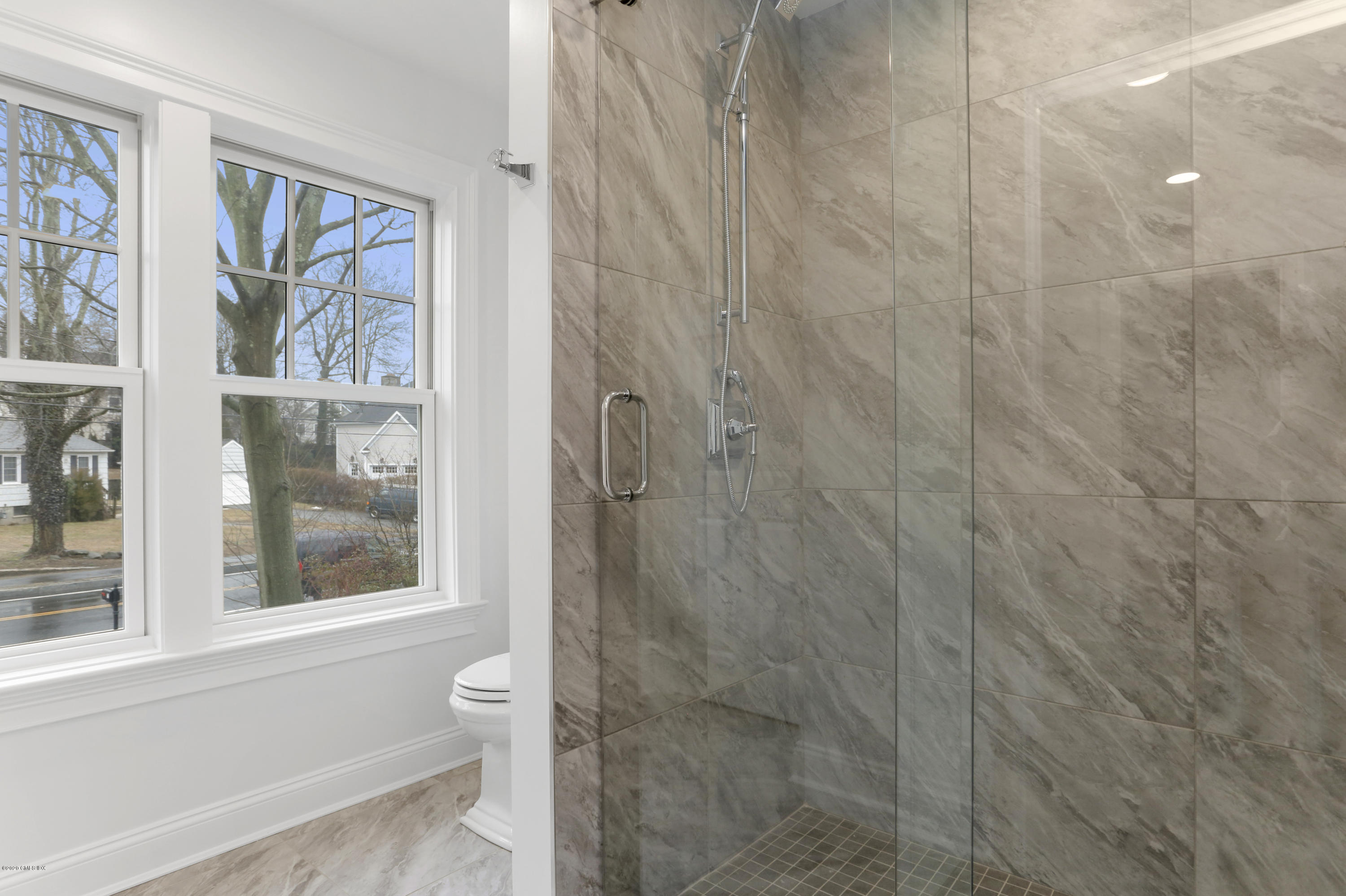 72 Riverside Lane Riverside, CT 06878 - Photo 29 of 40 a bathroom with a window and a shower