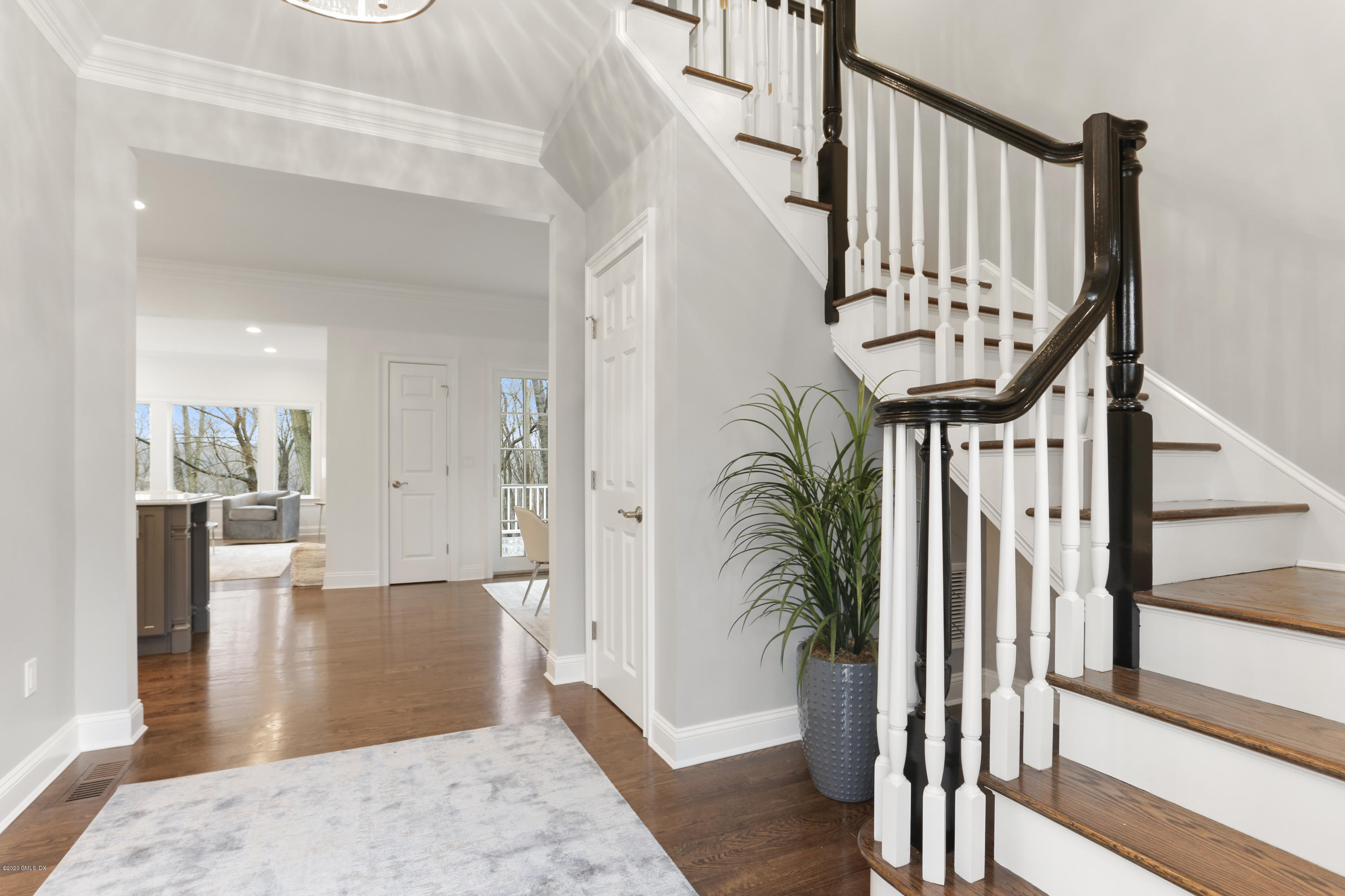 72 Riverside Lane Riverside, CT 06878 - Photo 5 of 40 a view of an entryway with wooden floor and a livingroom