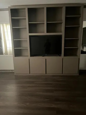 a view of a livingroom with wooden floor