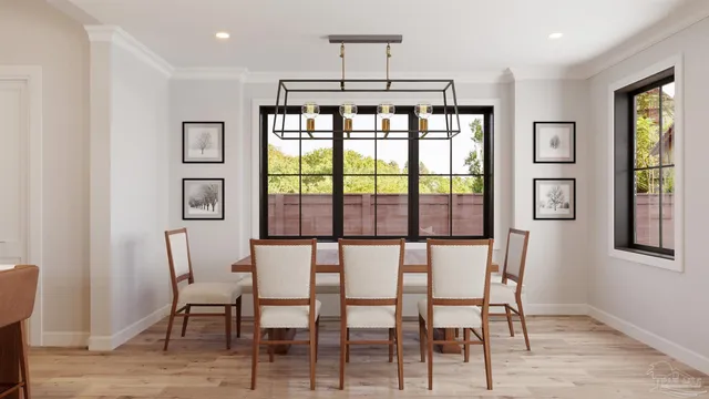 a view of a dining room with furniture window and wooden floor