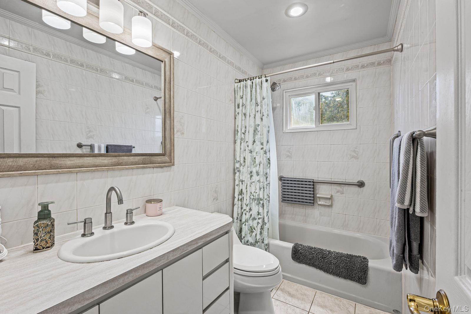 22 Larry Road Selden, NY 11784 - Photo 20 of 36 a bathroom with a sink toilet and shower