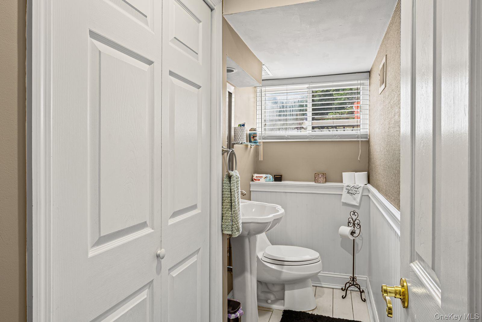 22 Larry Road Selden, NY 11784 - Photo 23 of 36 a bathroom with a sink a toilet and shower