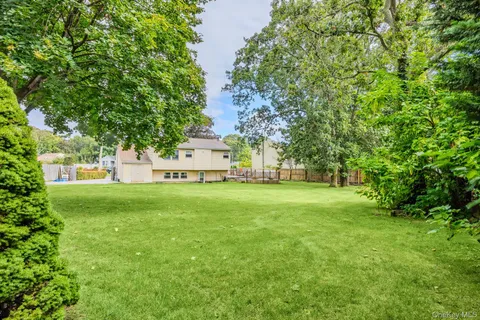 a view of a deck with chairs and wooden floor