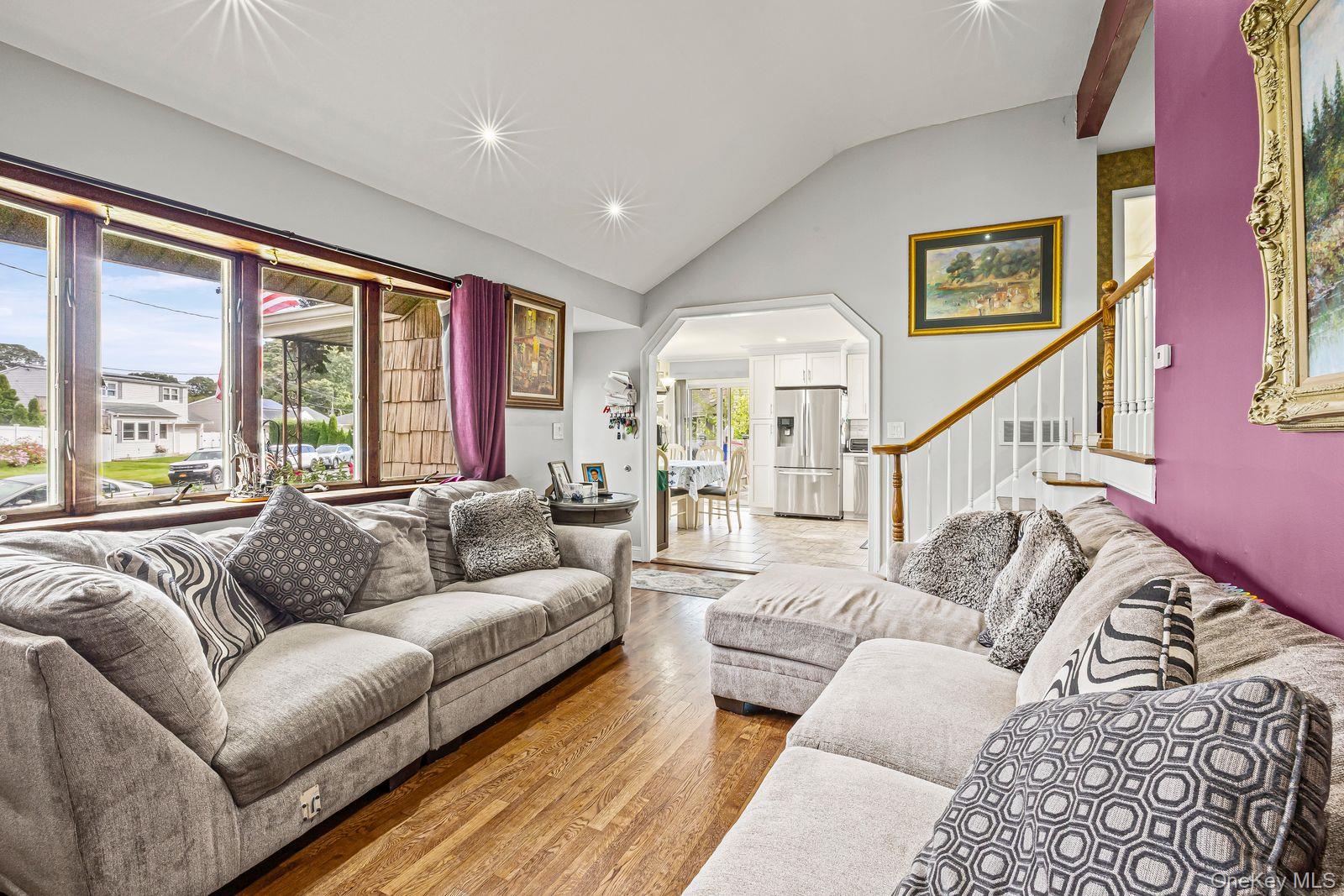 22 Larry Road Selden, NY 11784 - Photo 6 of 36 a living room with furniture and a large window