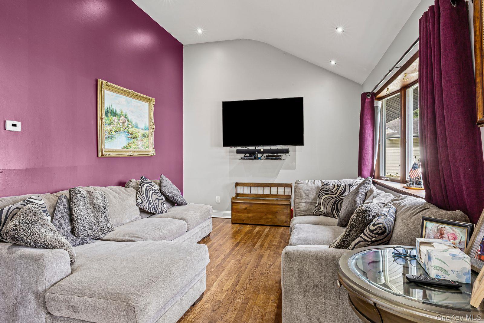 22 Larry Road Selden, NY 11784 - Photo 7 of 36 a living room with furniture and a flat screen tv