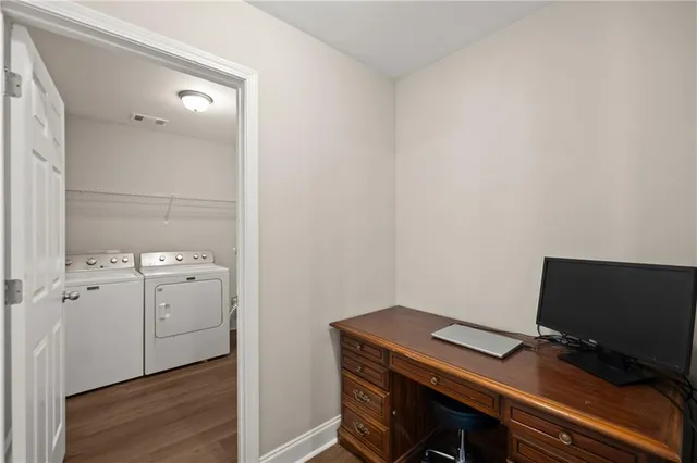 a view of workspace with wooden floor