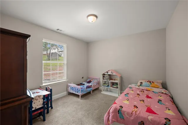 a bedroom with furniture and a window