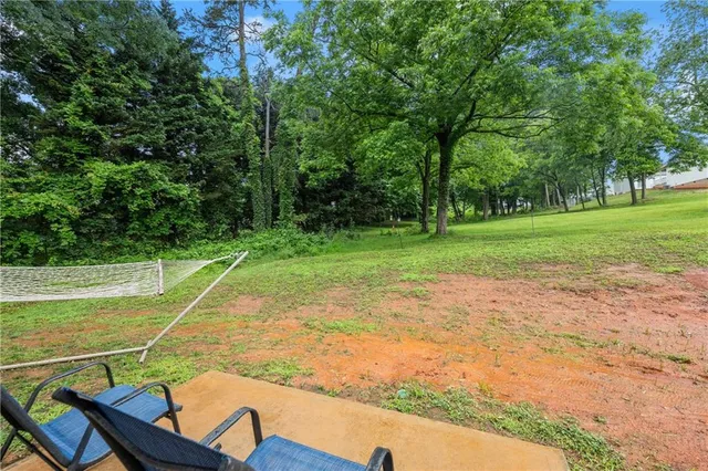 a view of a wooden deck with a yard