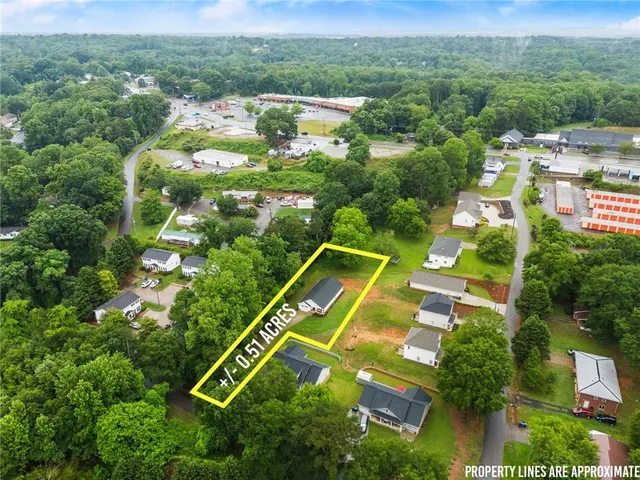 an aerial view of a house with a garden