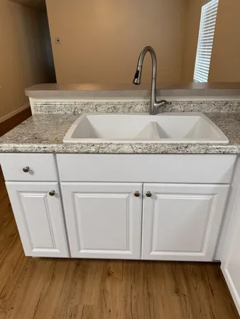 a view of cabinets and wooden floor