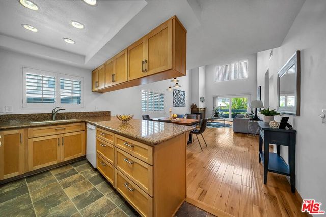 a kitchen with counter top space and a sink