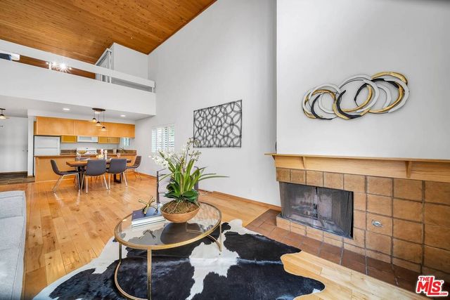 a living room with furniture and fireplace
