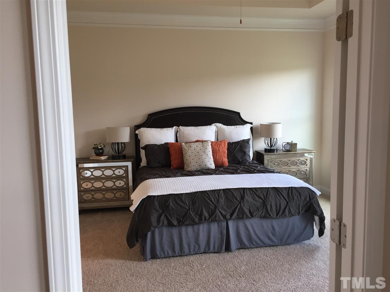 7463 Randshire Way Raleigh, NC 27616 - Photo 12 of 25 a bedroom with a bed and window