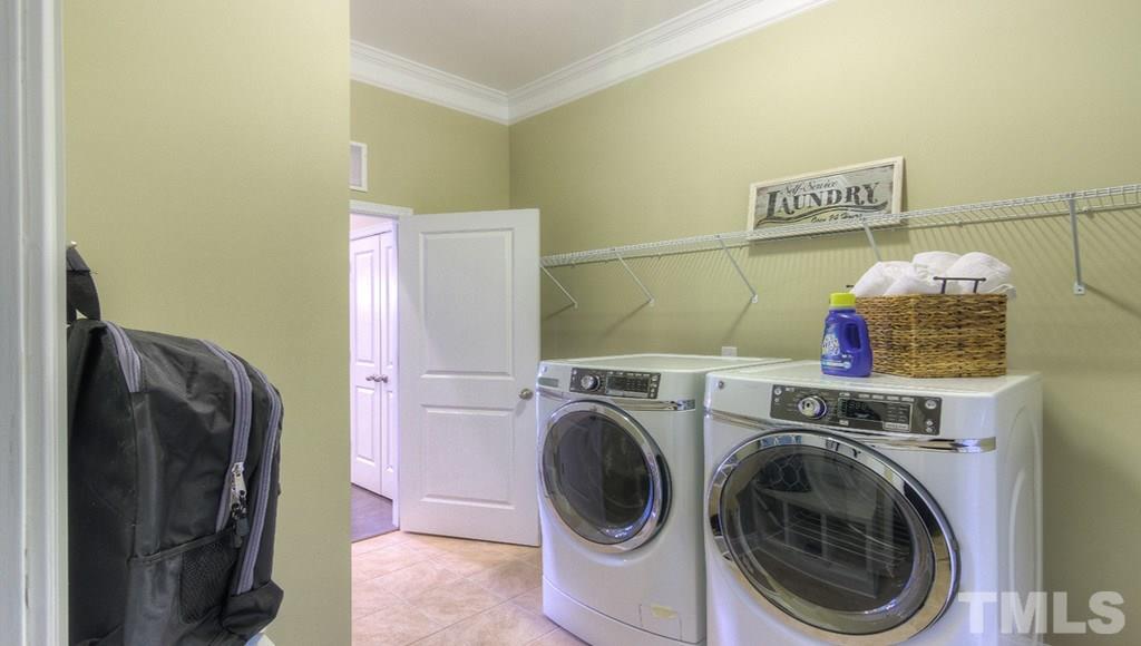 7463 Randshire Way Raleigh, NC 27616 - Photo 3 of 25 a utility room with dryer and washer
