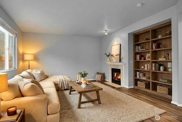 a living room with furniture window and bookshelf