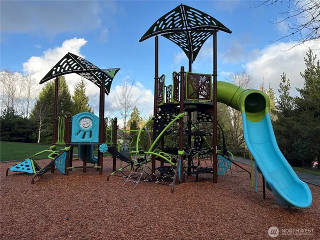 a view of a chairs in a backyard