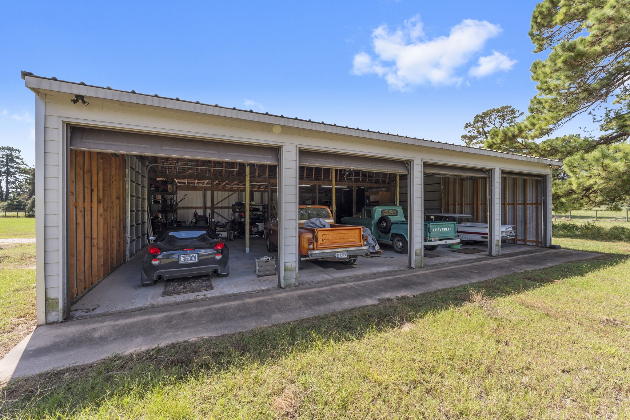 1534 Virgie Community Road Magnolia, TX 77354 - Photo 47 of 50 Imagine your classic cars or professional/amateur auto shop right here on Virgie Community Road! What dream cars would you have in these four bays?