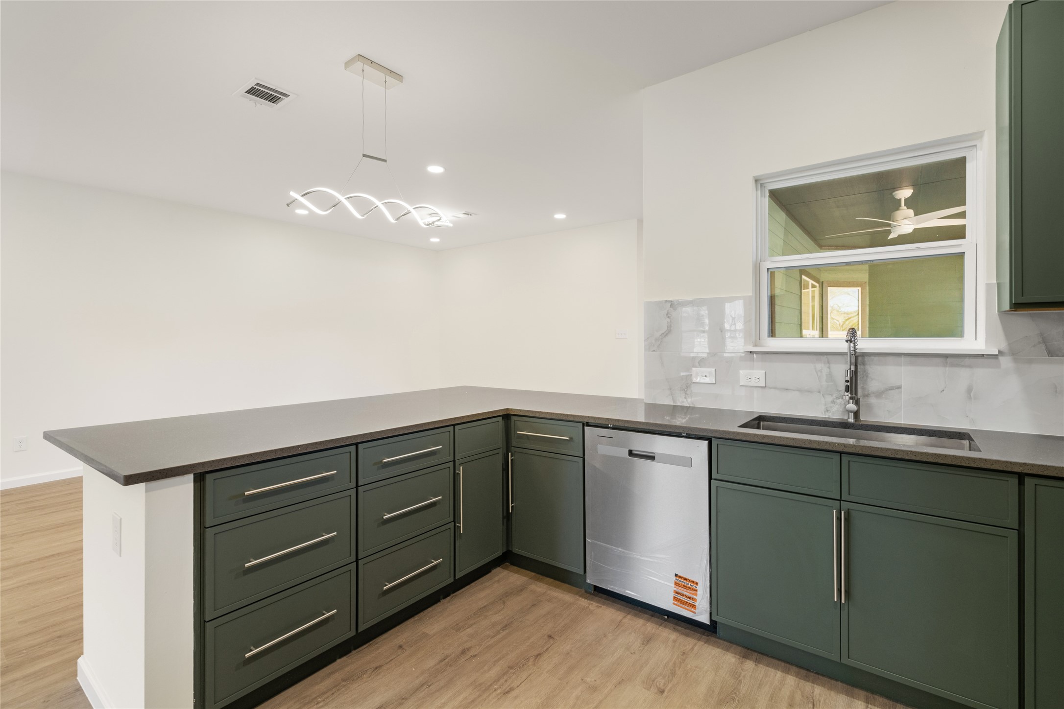 4656 North Teague Street Rosharon, TX 77583 - Photo 15 of 41 Modern finishes and clean lines elevate everyday cooking and dining.