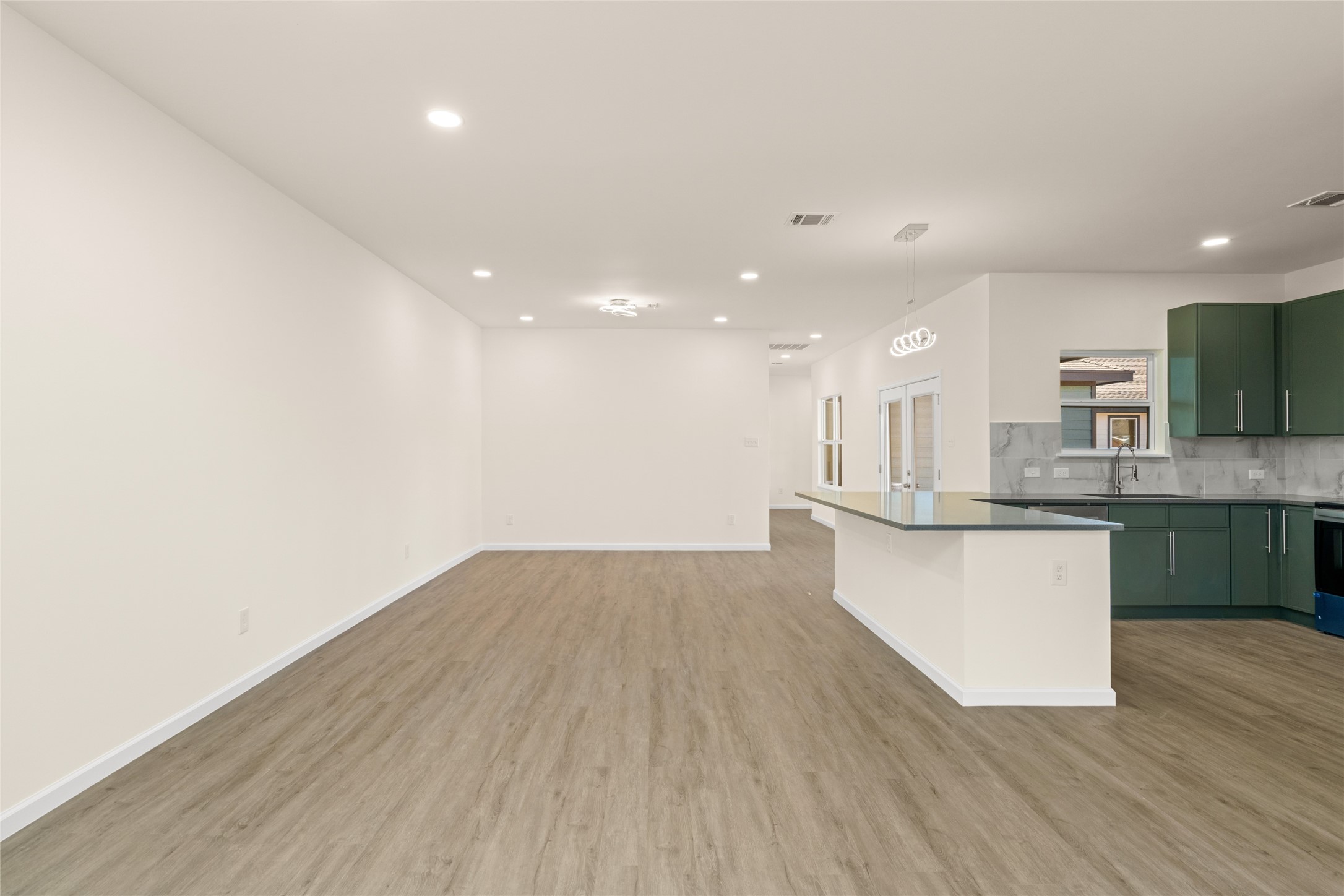 4656 North Teague Street Rosharon, TX 77583 - Photo 23 of 41 Open sightlines highlight the home’s thoughtful design and modern finishes.