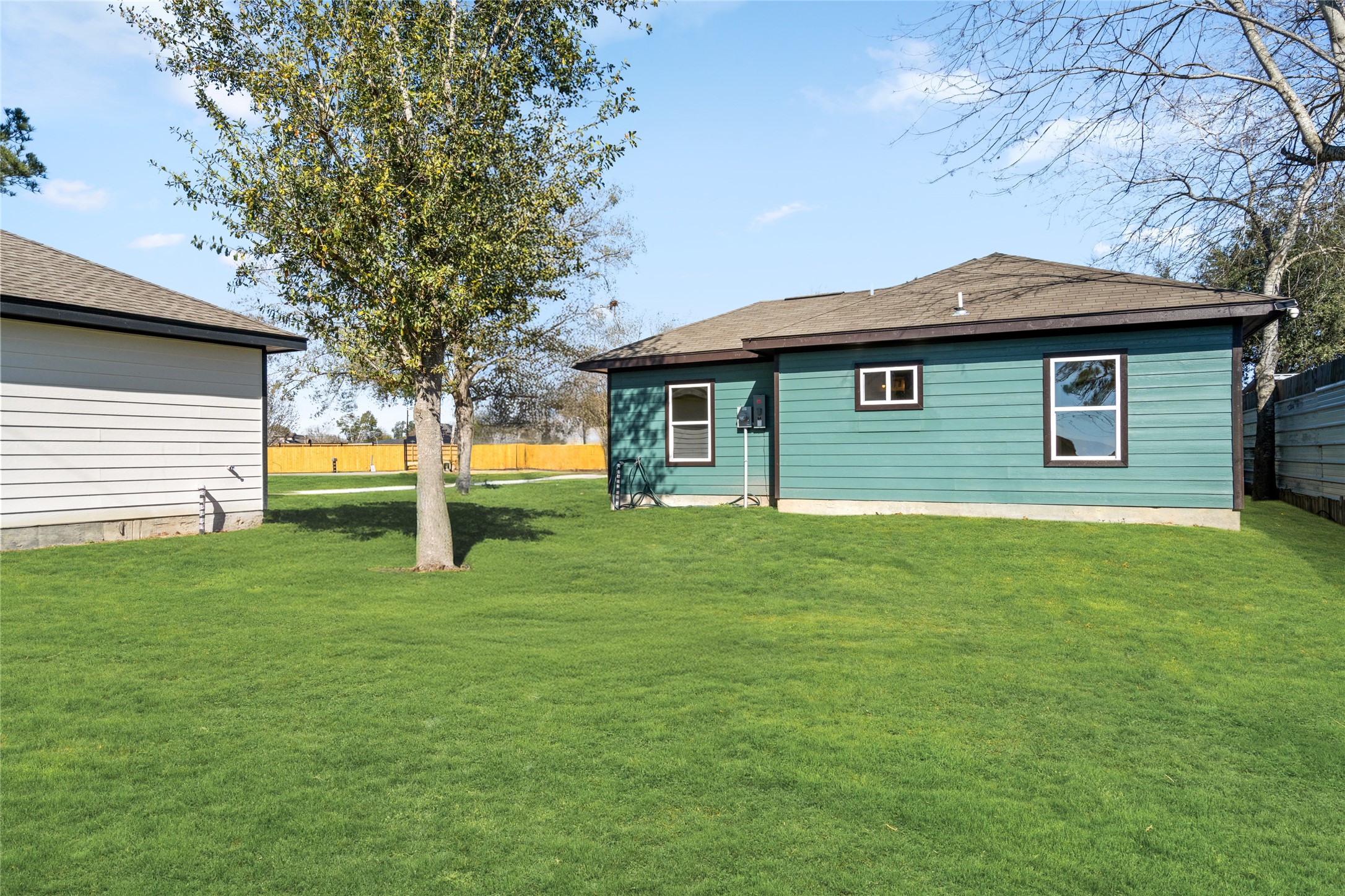 4656 North Teague Street Rosharon, TX 77583 - Photo 38 of 41 Rear exterior view highlighting the home’s fresh construction and spacious lot.