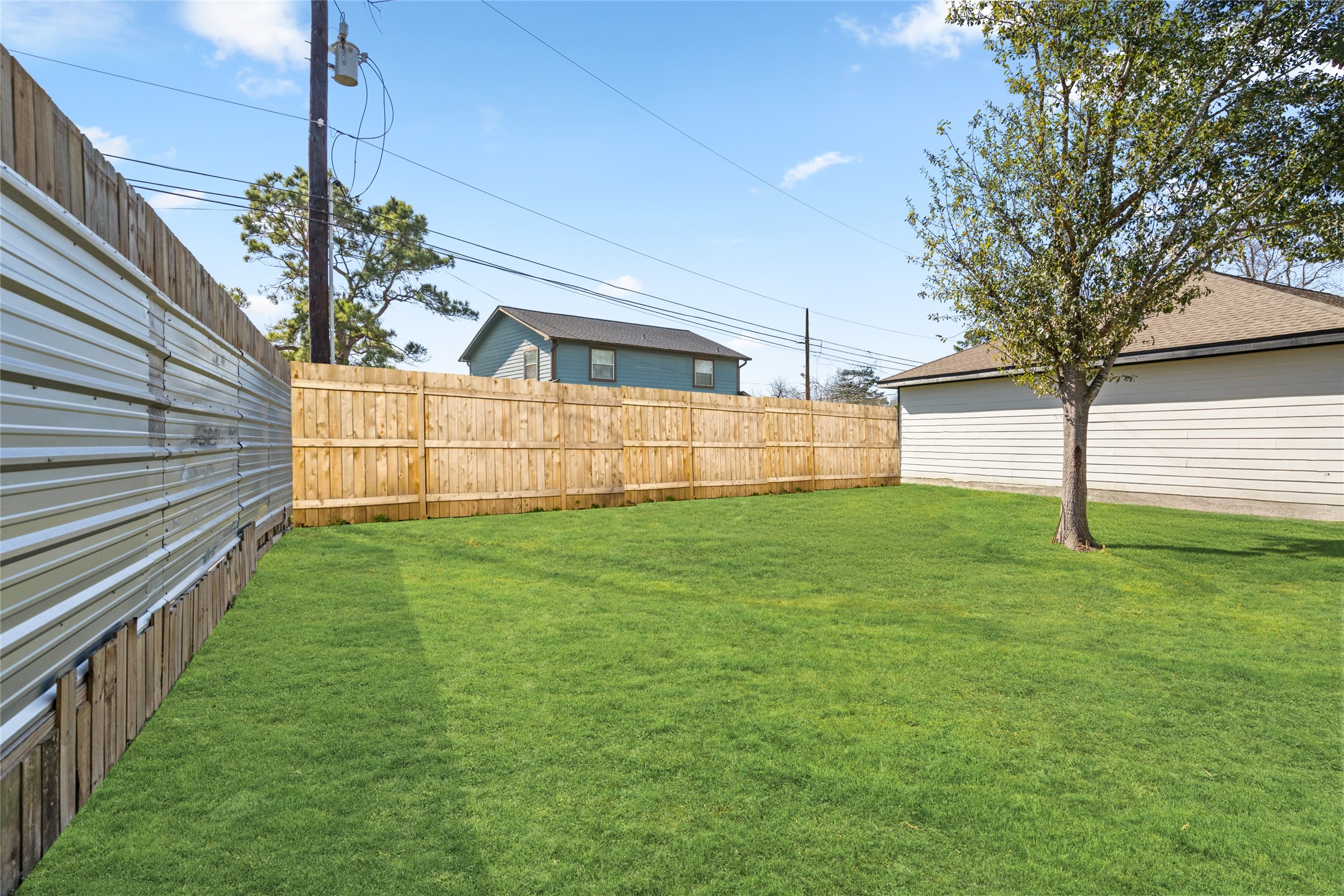 4656 North Teague Street Rosharon, TX 77583 - Photo 40 of 41 Wide, fenced yard provides privacy and room to create your ideal outdoor retreat.