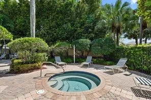 a view of swimming pool with seating space