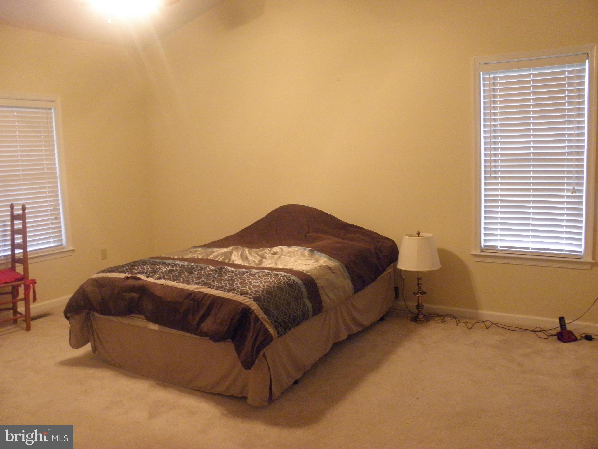208 John Rice Road Front Royal, VA 22630 - Photo 14 of 21 a bedroom with a bed and a window