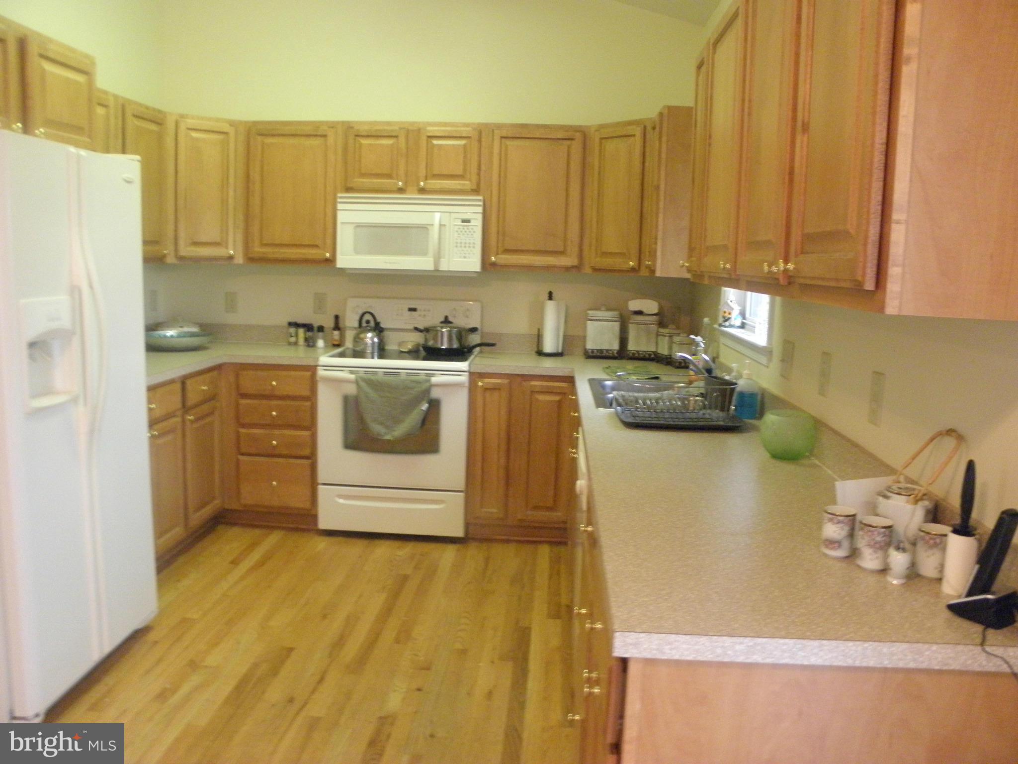 208 John Rice Road Front Royal, VA 22630 - Photo 7 of 21 a kitchen with a sink a stove and cabinets