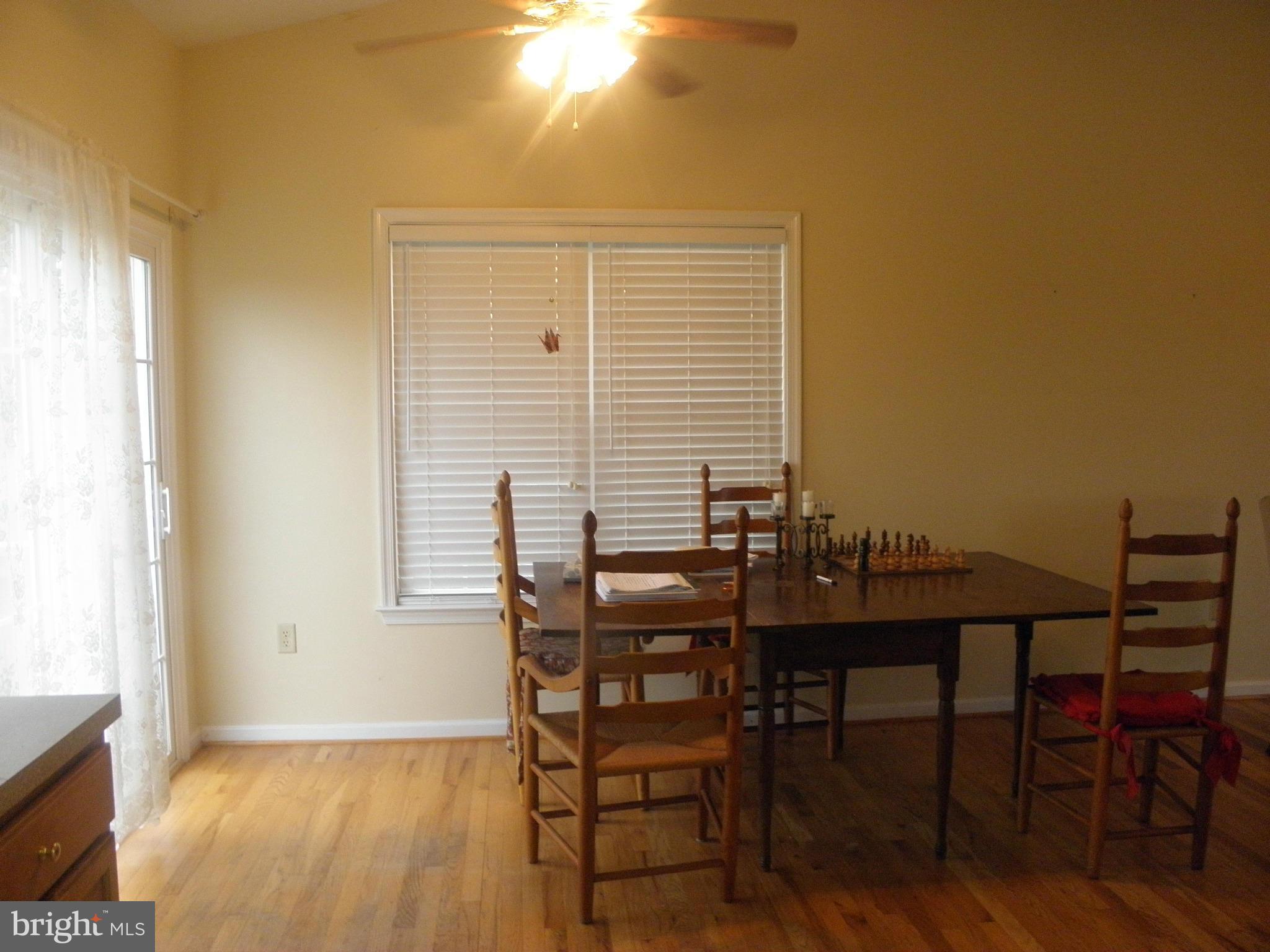 208 John Rice Road Front Royal, VA 22630 - Photo 8 of 21 a view of a dining room with furniture and wooden floor