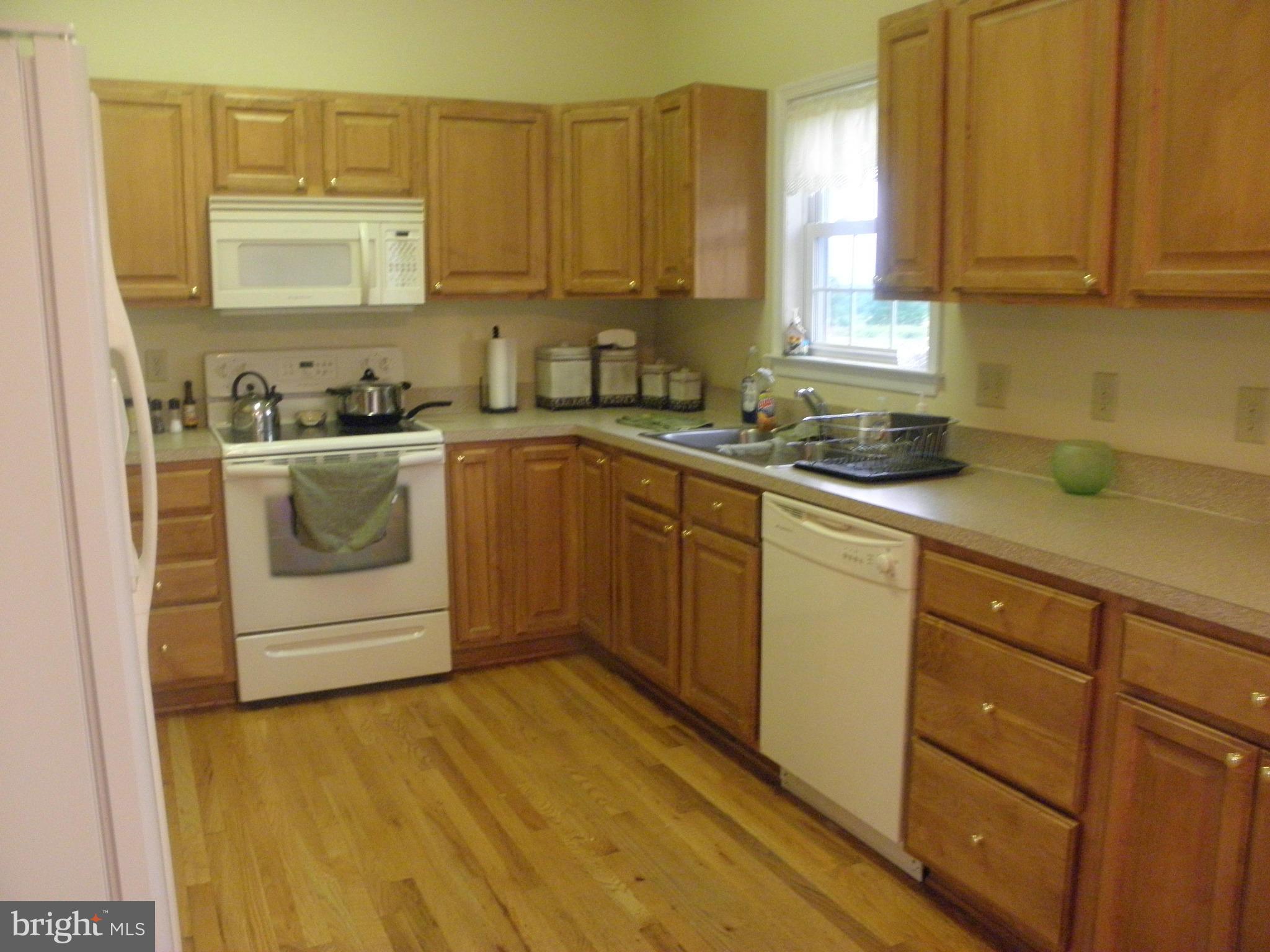 208 John Rice Road Front Royal, VA 22630 - Photo 9 of 21 a kitchen with stainless steel appliances granite countertop a sink a stove and cabinets