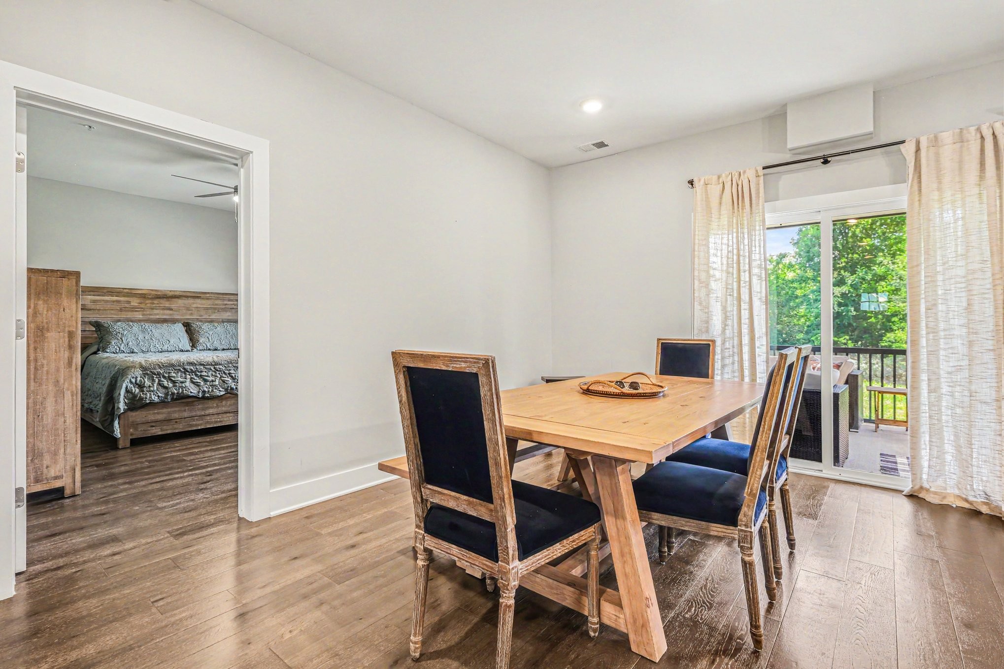 1144 Lock 4 Road, Unit H3 Gallatin, TN 37066 - Photo 10 of 22 a view of a dining room with furniture and wooden floor