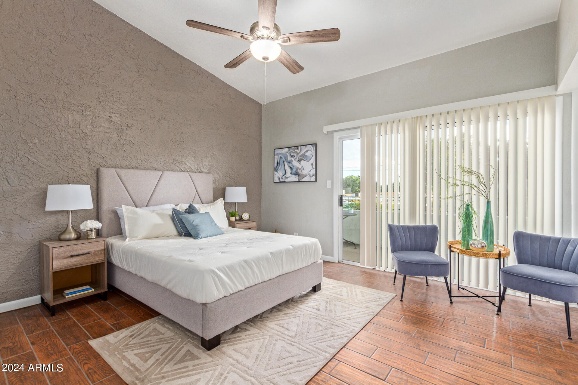 1602 East Ocotillo Road, Unit 121 Phoenix, AZ 85016 - Photo 13 of 31 a bedroom with a large bed and a couch