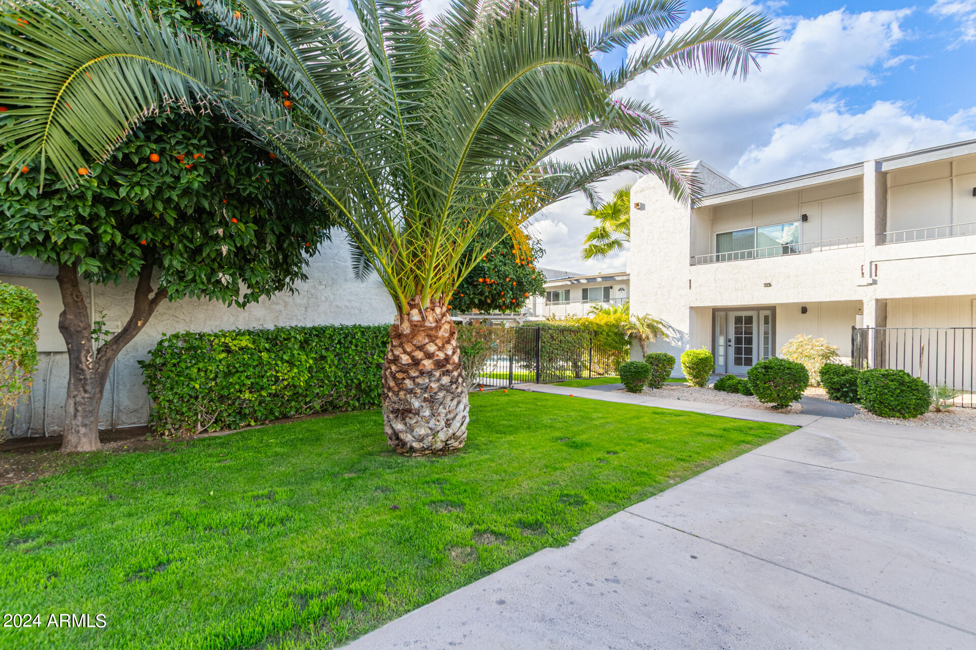 1602 East Ocotillo Road, Unit 121 Phoenix, AZ 85016 - Photo 2 of 31 a front view of a house with garden
