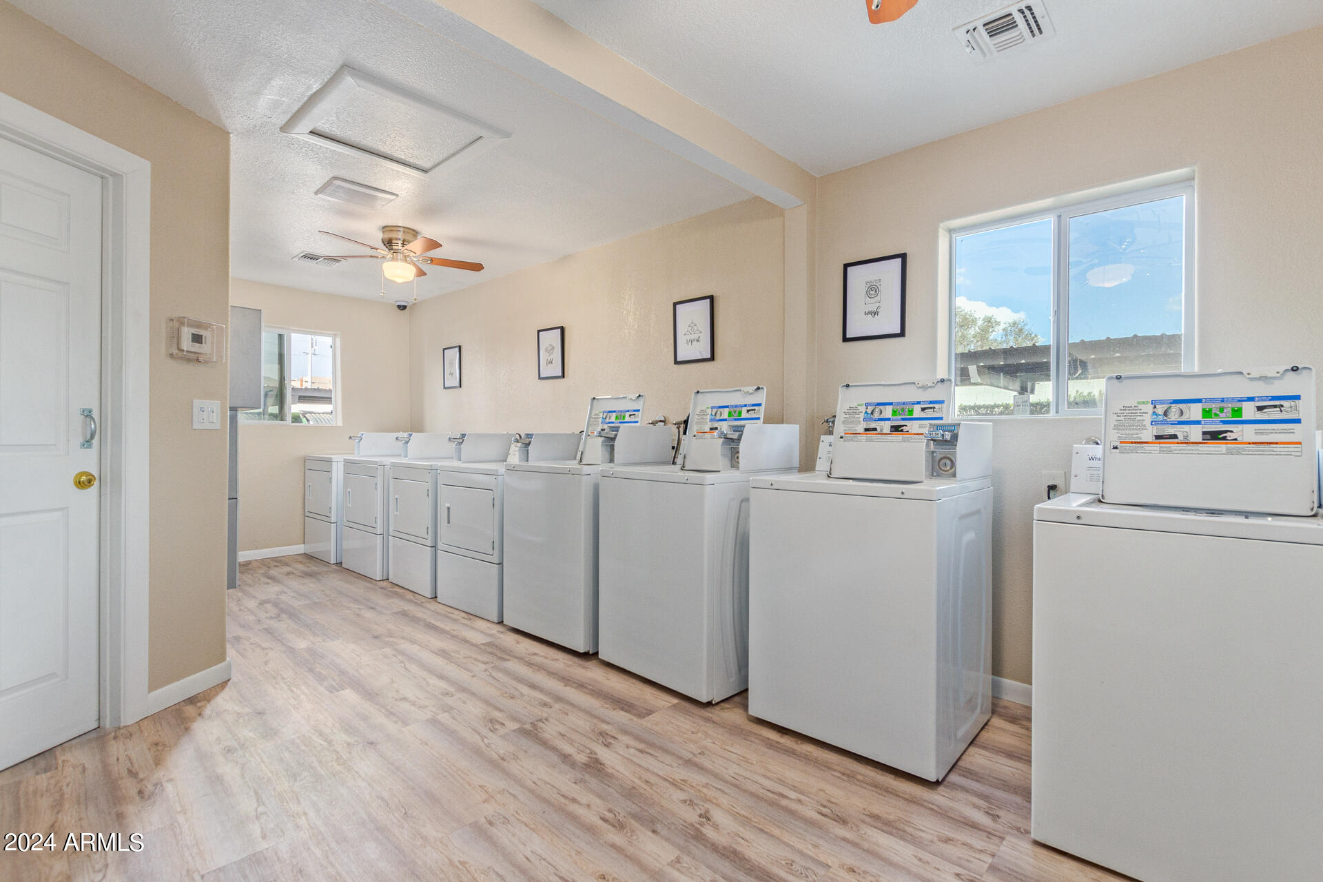 1602 East Ocotillo Road, Unit 121 Phoenix, AZ 85016 - Photo 22 of 31 a view of a kitchen with cabinets and wooden floor