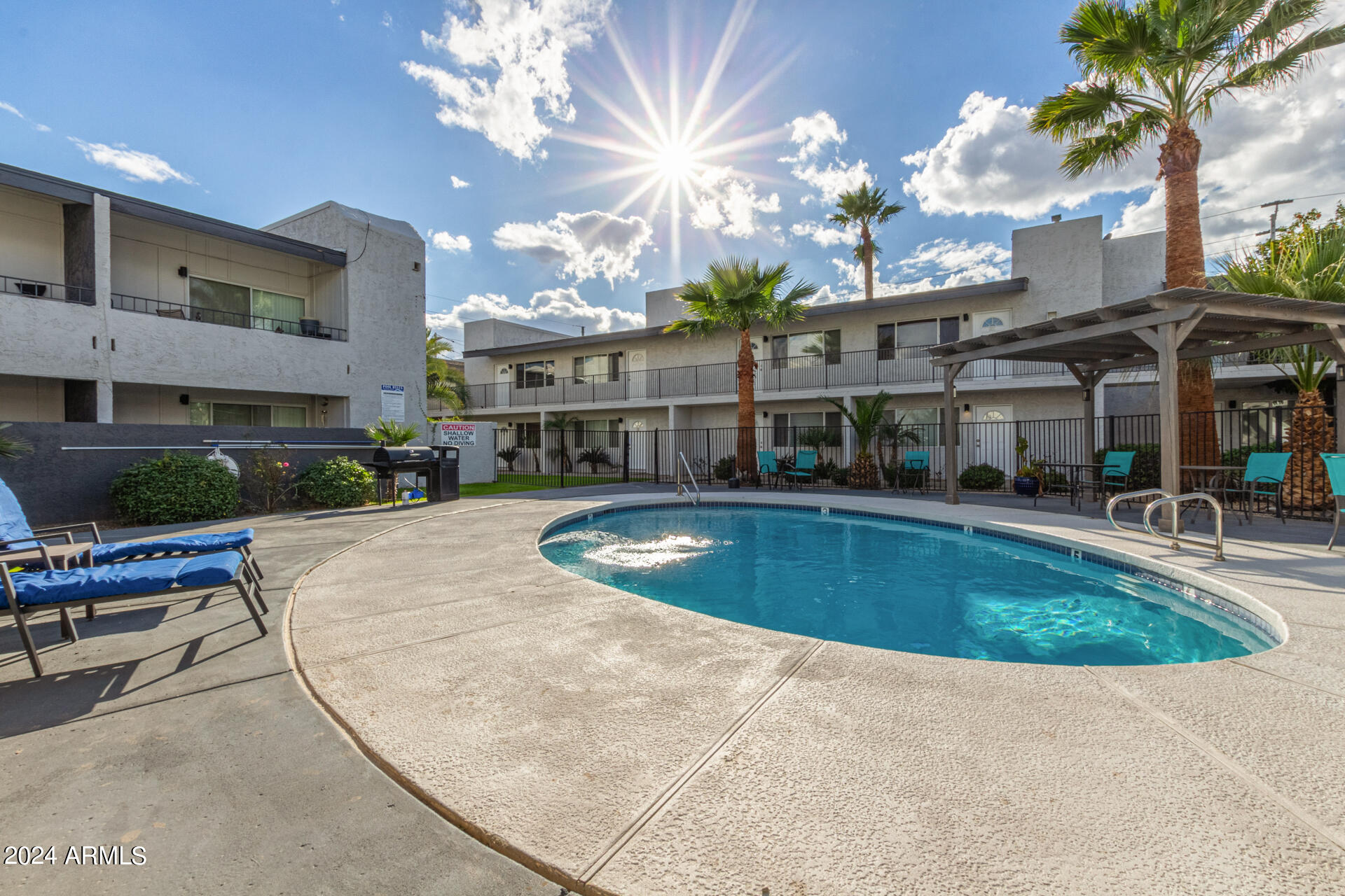 1602 East Ocotillo Road, Unit 121 Phoenix, AZ 85016 - Photo 27 of 31 a view of a house with a swimming pool