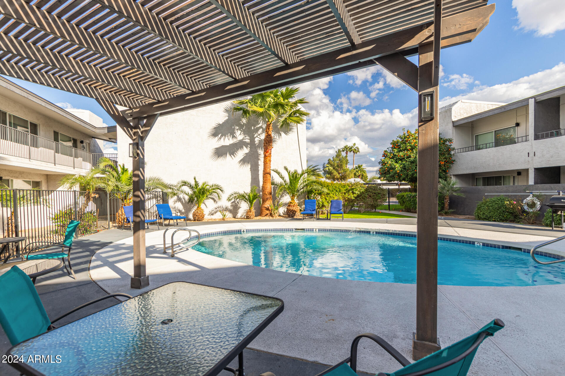 1602 East Ocotillo Road, Unit 121 Phoenix, AZ 85016 - Photo 29 of 31 a view of swimming pool with patio