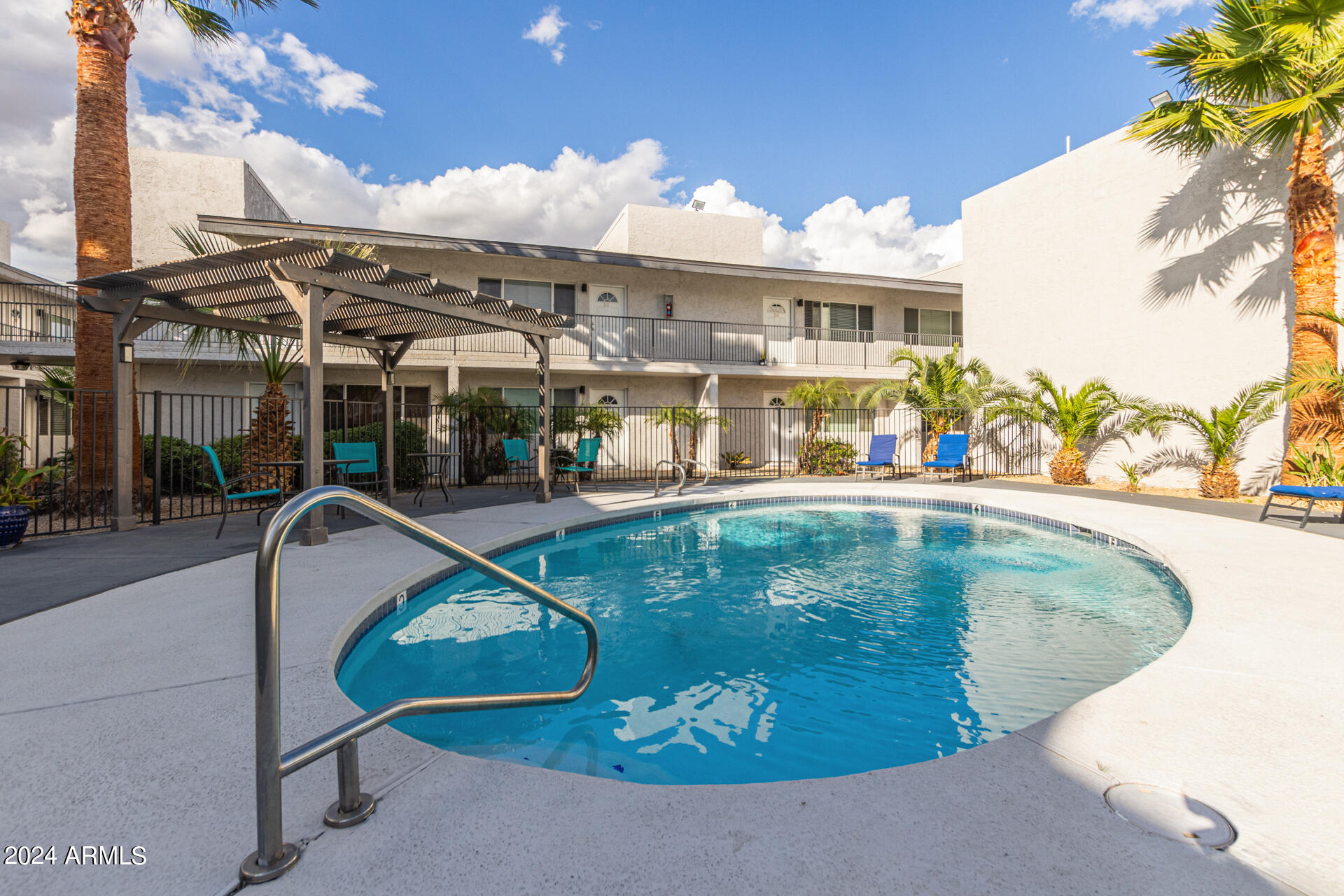 1602 East Ocotillo Road, Unit 121 Phoenix, AZ 85016 - Photo 30 of 31 a view of a swimming pool with a patio