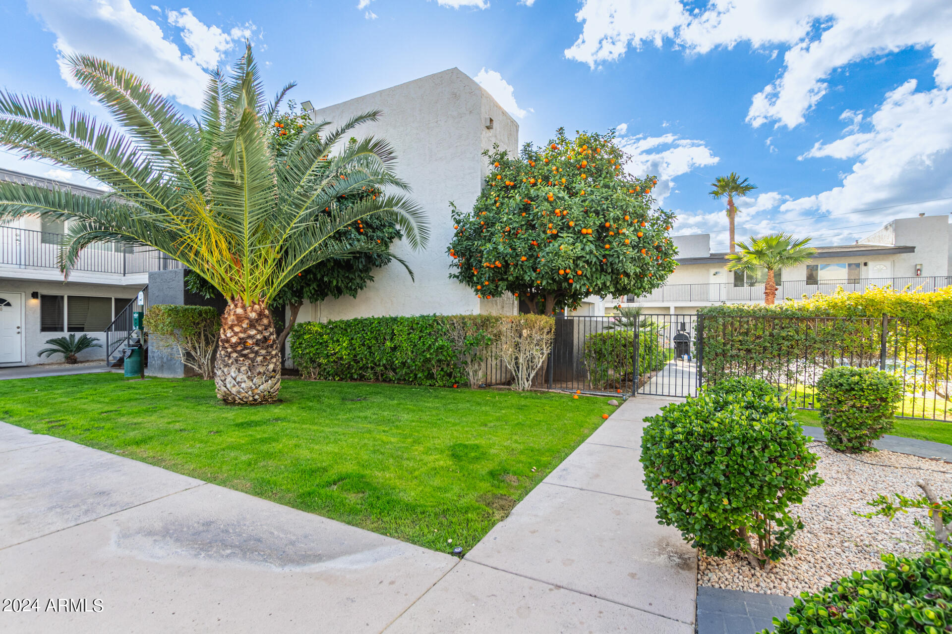 1602 East Ocotillo Road, Unit 121 Phoenix, AZ 85016 - Photo 3 of 31 a front view of a house with garden