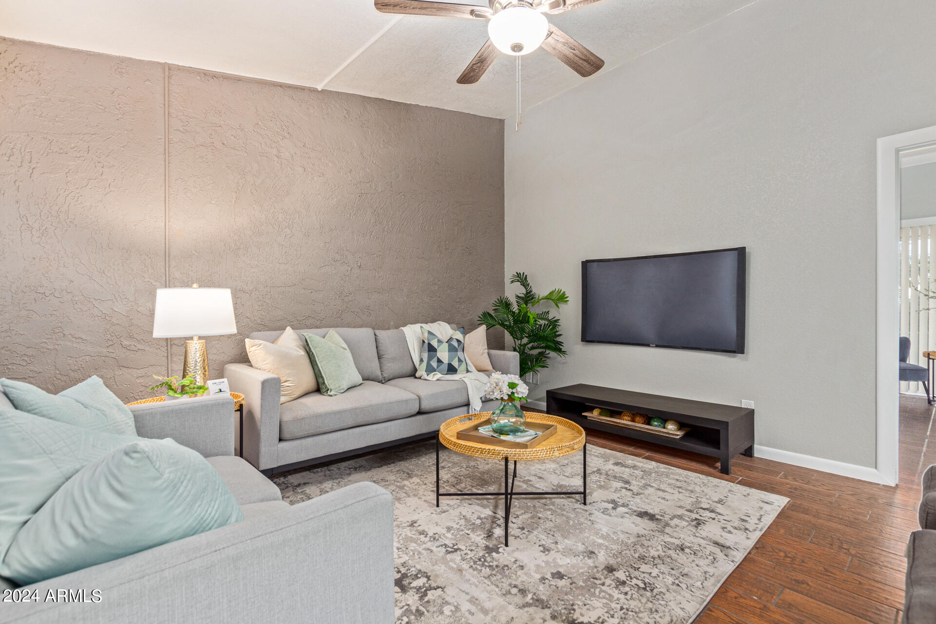 1602 East Ocotillo Road, Unit 121 Phoenix, AZ 85016 - Photo 4 of 31 a living room with furniture and a flat screen tv