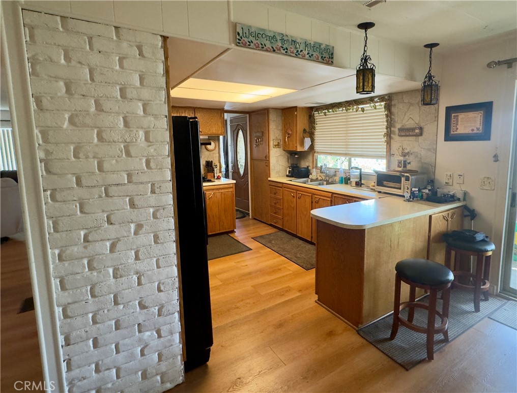 8651 Foothill Boulevard, Unit 18 Rancho Cucamonga, CA 91730 - Photo 8 of 12 a kitchen with granite countertop a sink a counter top space and stainless steel appliances